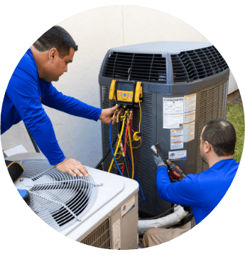 Punbar employees working on maintenance for an outdoor air conditioner